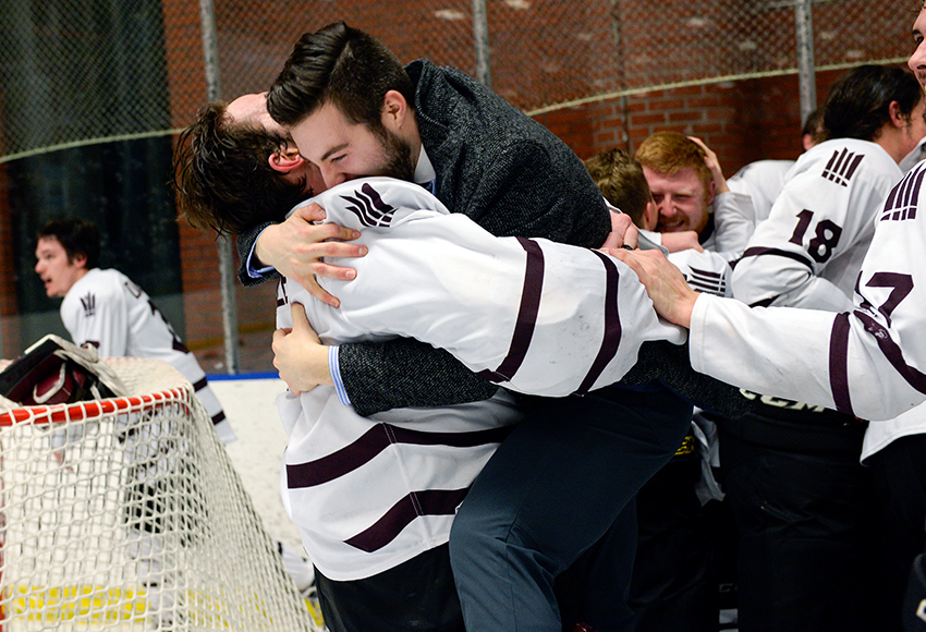 Ryan Larochelle, right, embraces fellow Griffins goaltender Marc-Olivier Daigle after MacEwan clinched its second-straight ACAC Championship at NAIT Arena last March (Len Joudrey photo).