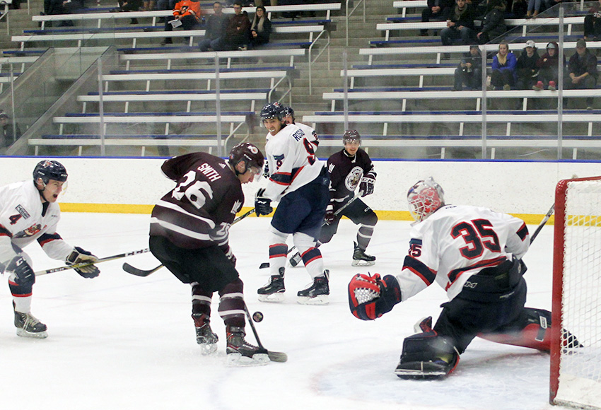 Dallas Smith gets a chance in front of Portage goaltender Jordan Brant on Friday night (Melbourne Disbrowe photo).