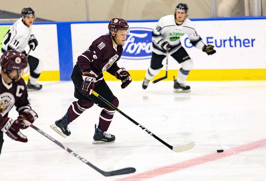 Bryan Arneson carries the puck up the ice in MacEwan's home opener against Red Deer College last weekend. He's back at MacEwan after a tour in the minor pro ranks (Joel Kingston photo).