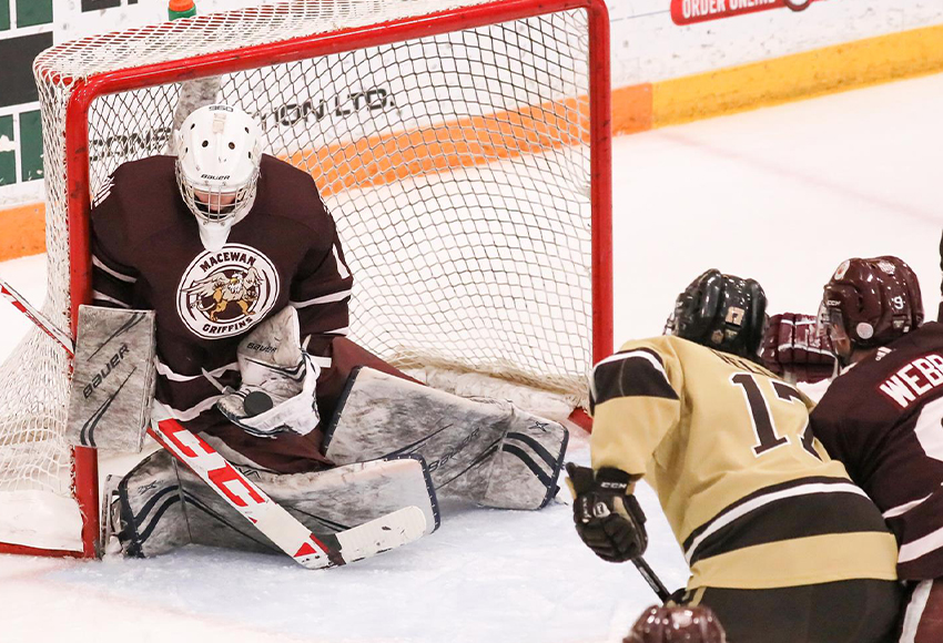 Ty Taylor makes one of his 32 saves against Manitoba on Friday night (Dave Mahussier photo).