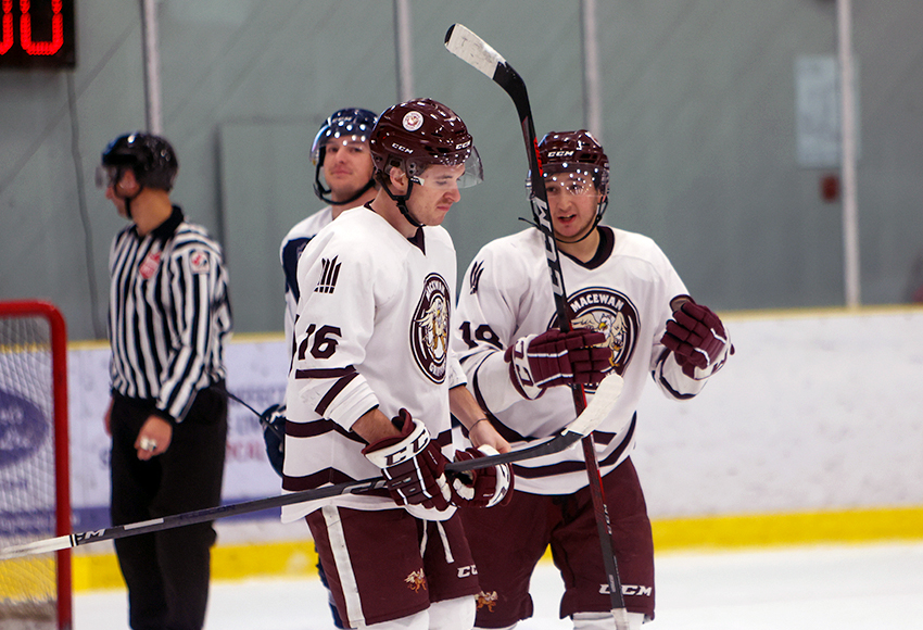 Ethan Strang, left, and Nic Correale chat before lining up for a face-off on Saturday (Tyler Jones photo).