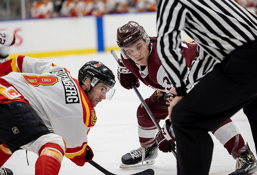 Brendan Boyle lines up for a faceoff against Calgary's Connor Gutenberg during a game earlier this season (Rebecca Chelmick photo).
