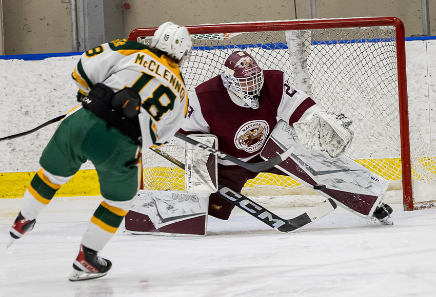 Brett Epp makes a point-blank save on Alberta's Connor McClennon, one of 36 he had on the evening (Rebecca Chelmick photo).