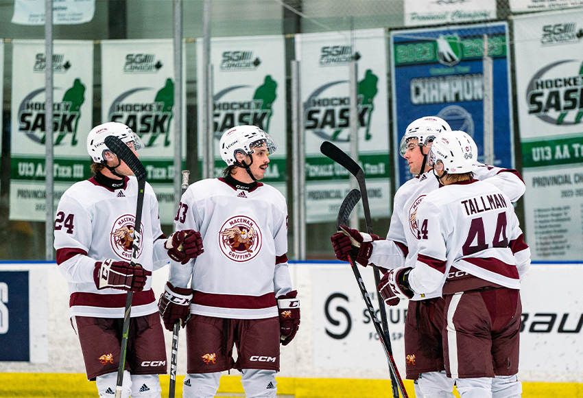 Griffins players help Loeden Schaufler (second from right) celebrate one of his two goals on Friday (Calvin Hui photo).