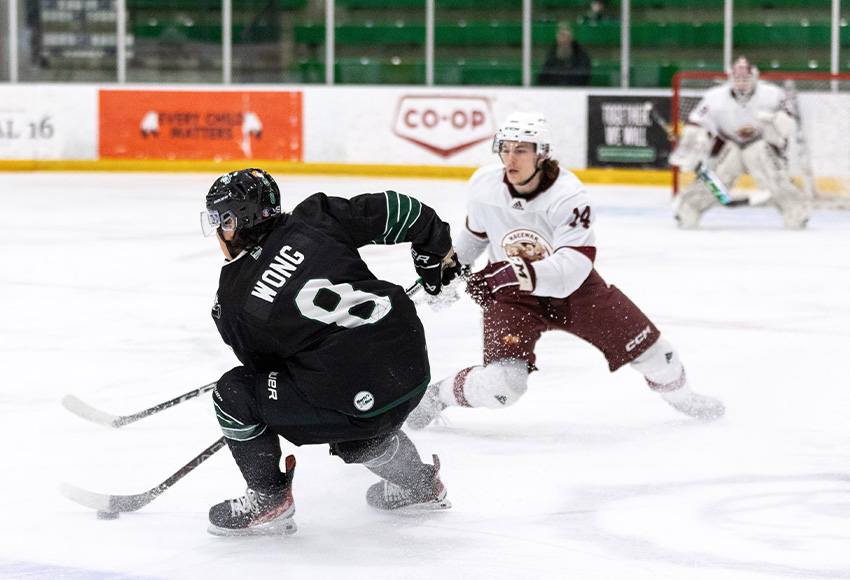 Logan Dowhaniuk keeps tabs on Saskatchewan's Trevor Wong Friday (Rachel Albertson photo).