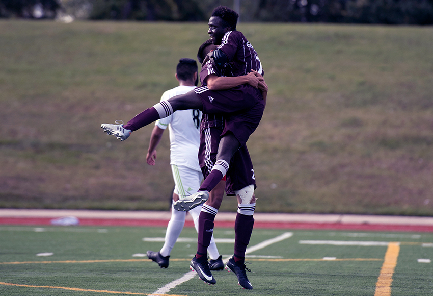 Lahai Mansaray leaps into the arms of Christian Hernandez to celebrate the Griffins' first goal of the game on Sunday (Chris Piggott photo).