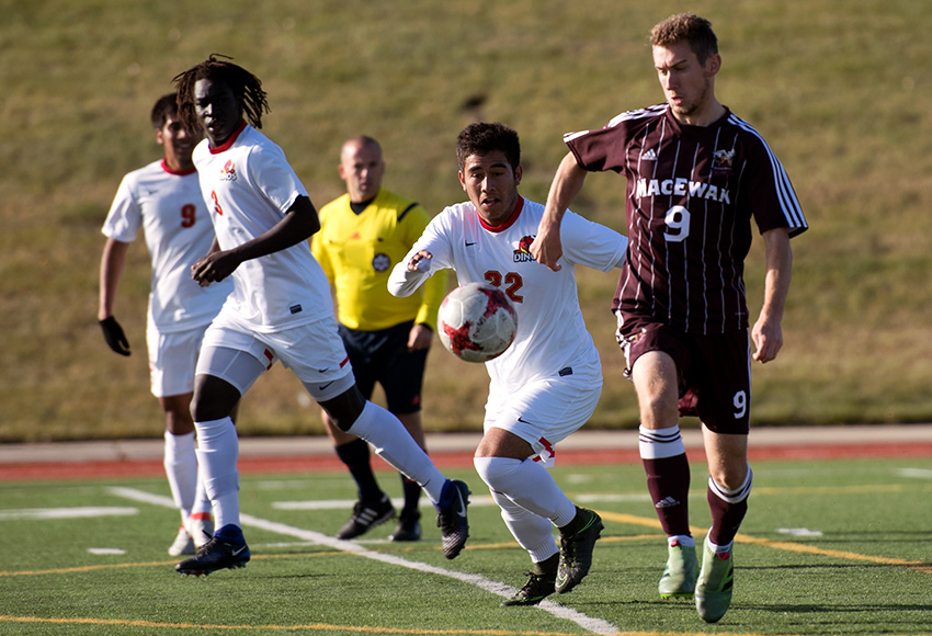 MacEwan's Brian Mayall, right, battles for the ball with Calgary's Jarred Ferreira during Sunday's game (Chris Piggott photo).
