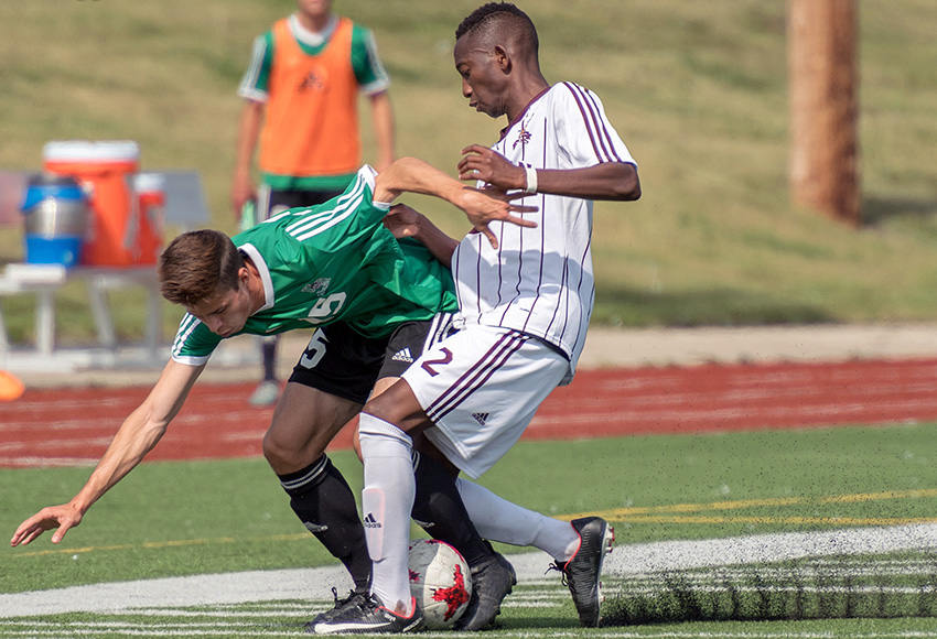 MacEwan's Zibusiso Moyo battles against Saskatchewan's Tanner Stephens during a Sept. 2 meeting between the teams at Jasper Place Bowl. Moyo will be counted on to anchor the Griffins' back line in Thursday's rematch (Chris Piggott photo).