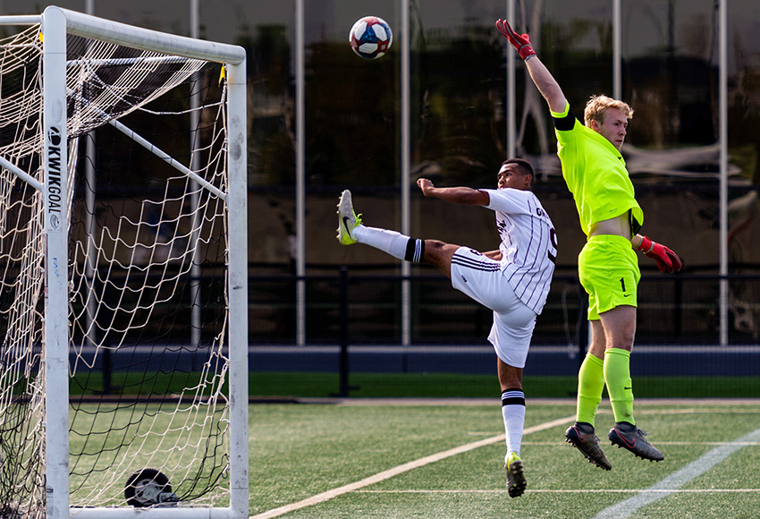 Kapri Simmons gets a chance in tight on Calgary goalkeeper Jake Ruschkowski during a meeting between the teams earlier this season at Clareview Field. They meet again in Calgary on Sunday (Chris Piggott photo).