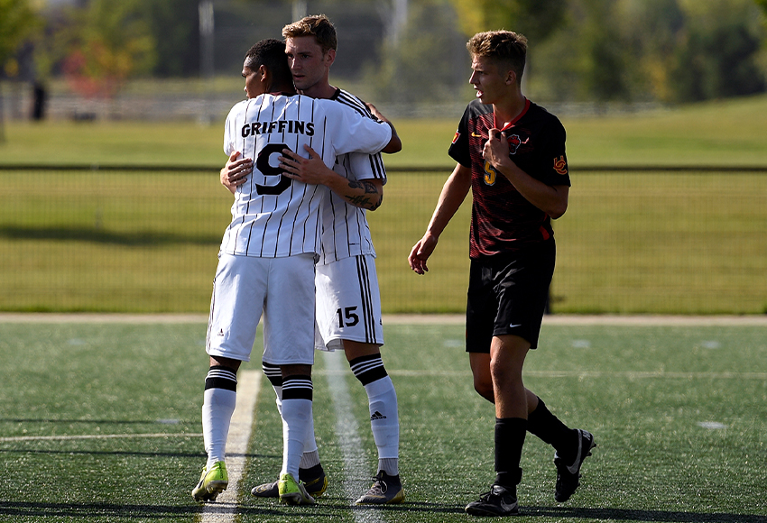 Everett Orgnero receives congratulations from Marcus Simmons after scoring the game-winning goal on a penalty shot in the first half on Saturday (Chris Piggott photo).