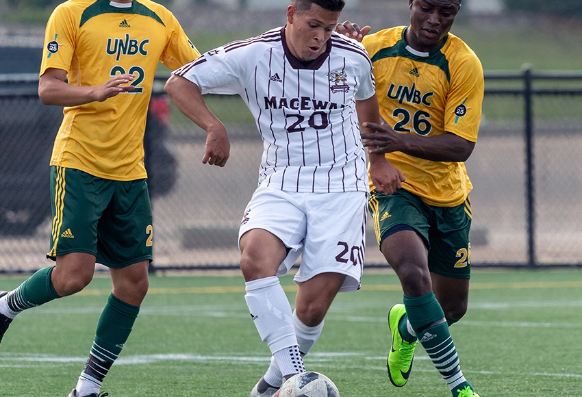 Jose Cruz moves the ball against UNBC during a game last season. He's one of five graduating seniors heading into their final weekend with the Griffins (Chris Piggott photo).