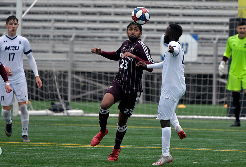 Sheldon Prasad heads a ball out of danger against Mount Royal University last Sunday. He is the only starting defender eligible to play for the Griffins in Friday's visit to UBCO, so the team's depth will be tested (Chris Piggott photo).