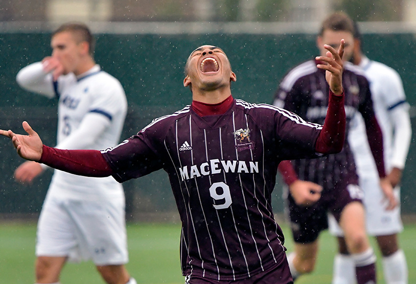 Marcus Simmons celebrates his goal in the 22nd minute, which gave the Griffins a 1-0 lead over MRU, but it wouldn't last after they were forced to play with only 10 men for the final 56 minutes (Chris Piggott photo).