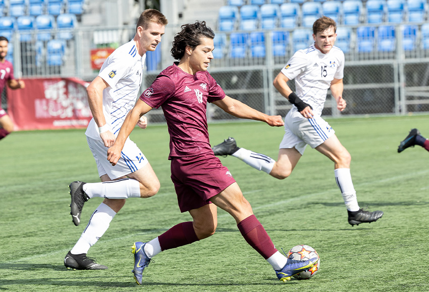 Egzon Jeteshi carries the ball in a game against UBC Okanagan last weekend. He led the Griffins with two shots in Friday's 3-0 loss at Trinity Western (Rebecca Chelmick photo).