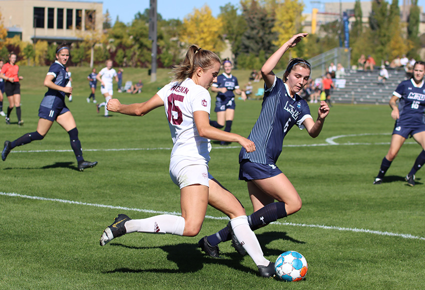 Maya Morrell launches a ball under pressure from a MRU defender on Sunday (Ellery Platts photo).