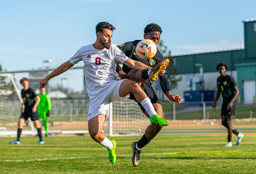 Ali Yildiz leaps into the air to battle for a ball on Sunday (Adrien Bazinet photo).