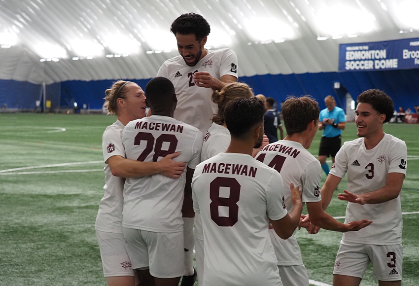 Griffins players surround Chance Carter (#28) after he scored the opening goal on Saturday, assisted by Jamal Ajab, right (Norman Bo photo).