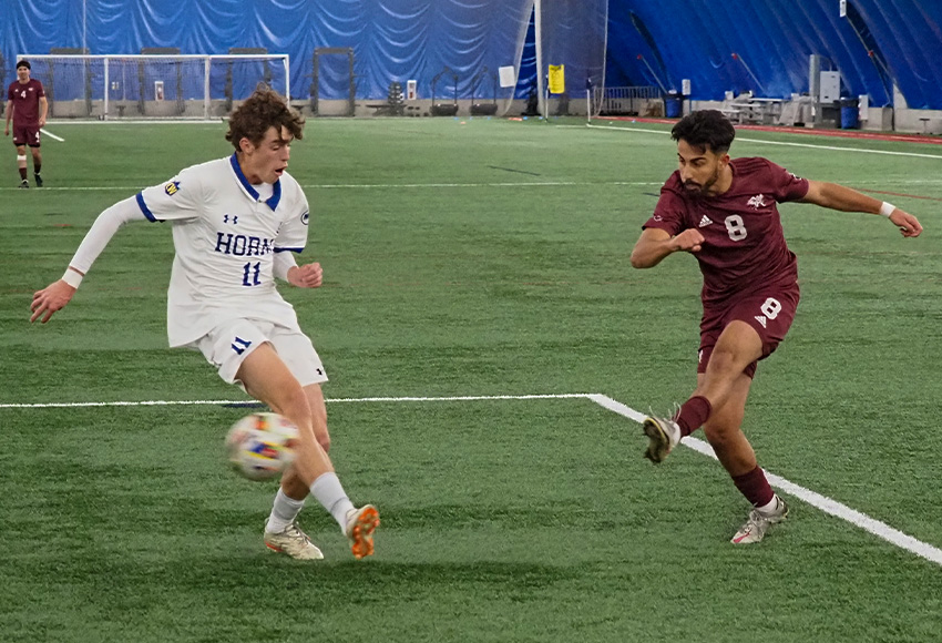 Ali Yildiz blasts it past Lethbridge's Ben Gingras to score the game-winning goal in the 21st minute, his first of two on the day. Ricky Yassin drew an assist on the play to become the program's career Canada West points leader (Norman Bo photo).