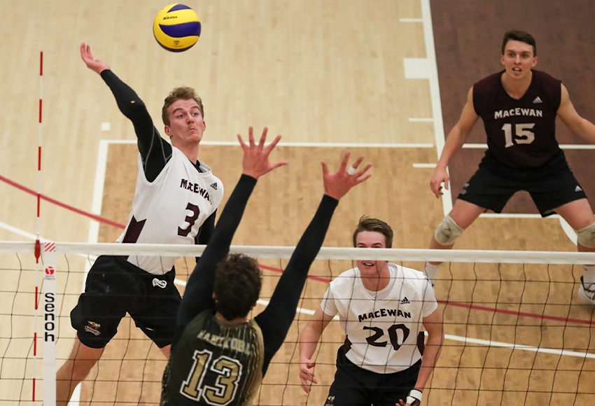 Jordan Peters elevates for a kill attempt in the face of a block by Manitoba's Owen Schwartz on Saturday (Eduardo Perez photo).
