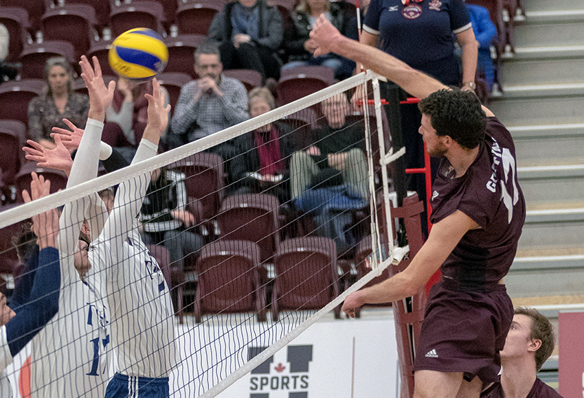 Mark Alexander sends a blast over to Trinity Western's side of the court during a match against the Spartans last season in the David Atkinson Gym. MacEwan visits TWU this weekend (Eduardo Perez photo).