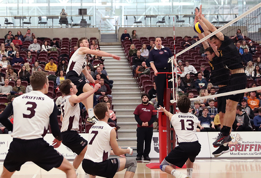 Max Vriend hits against Alberta's block on Saturday. He finished with a match-high 11 kills, but the Griffins lost in straight sets (Eduardo Perez photo).