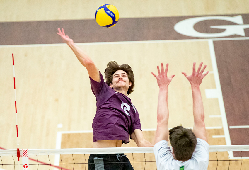 Alexei Walisser, shown going up for a kill on Friday, had the key block that ended Saturday's match in MacEwan's favour (Eduardo Perez photo).