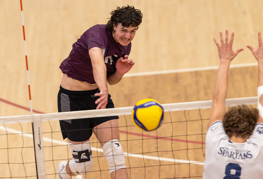 Mitchell Croft unloads on a kill down the line. He led the Griffins with 10 kills and 11.0 points in first Canada West regular season match (Robert Antoniuk photo).