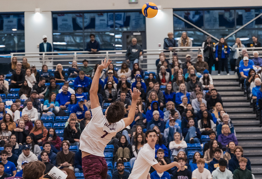 Mason Natras sets to Mitchell Croft during Friday's match. Croft led the Griffins with 17 kills and accounted for 18.5 points in Saturday's match (Aaron Rempel photo).