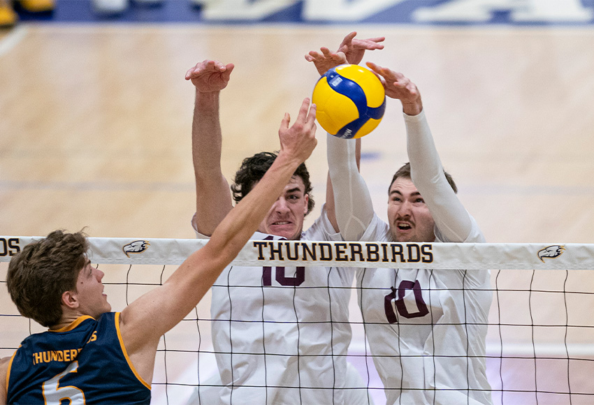 Seth Birkholz, right, and Mitchell Croft block UBC's Gavin Moes on Friday night. The Griffins gave the Thunderbirds another good battle on Saturday (Rich Lam photo).