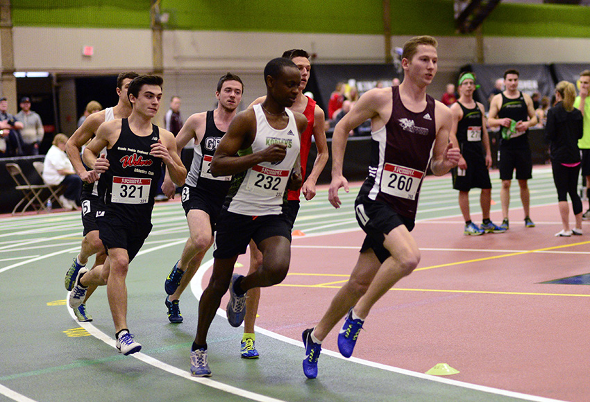 Scott Kohlman leads a group of runners around the bend during the 2017 MacEwan Invitational indoor track meet at the Kinsmen Field House. This year's even is set for Jan. 27 (Len Joudrey photo).