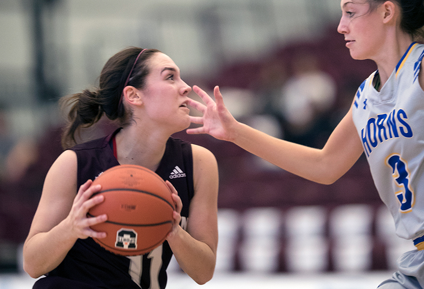 Paige Knull looks for an opening against Lethbridge's Katie Keith on Satuday. Knull had a game-high 24 points for the Griffins (Robert Antoniuk photo).