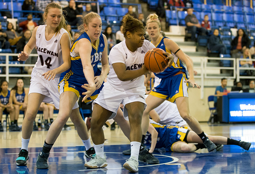 Kristen Monfort-Palomino secures a rebound for the Griffins against UBC on Saturday night (Bob Frid, UBC Thunderbirds).