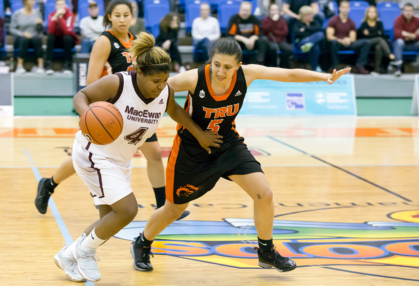 MacEwan's Kristen Monfort-Palomino is guarded by TRU's Leilani Carney in Saturday's game (Andrew Snucins photo).