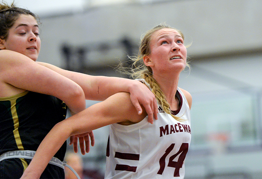 Shannon Majeau looks for a rebound against UNBC during a preseason game last weekend (Rich Abney photo).