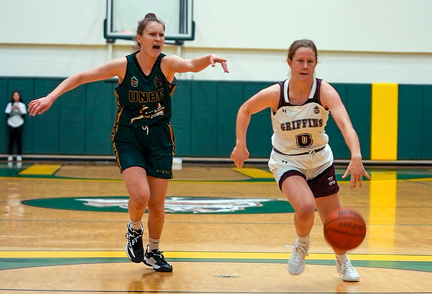 Julie Dueck busts past a UNBC defender on Saturday night (Rich Abney photo).