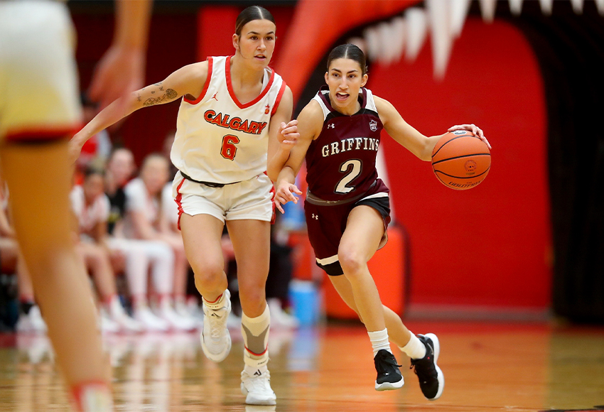 Allie Spenrath, who led the Griffins with 10 points, moves the ball up court against Calgary's Kourtney Oss on Friday (David Moll photo).