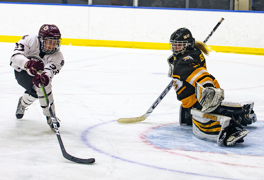 Shyla Jans, seen in alone on Olds goalie Lexi Bruce during a game last month, notched an assist last Friday against NAIT to break the Griffins' career points mark with 62 (Joel Kingston Photography).