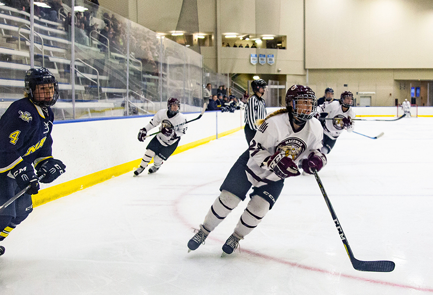 Shyla Kirwer hunts for a loose puck against NAIT last Saturday at the Downtown Community Arena (Joel Kingston photo).