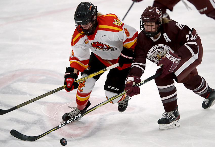Griffins assistant captain Rylee Gluska battles with Calgary's Alli Borrow during Saturday's game (David Moll photo).