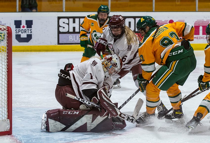 Brianna Sank makes one of her 23 saves against Alberta on Friday night (Connor Hood photo).