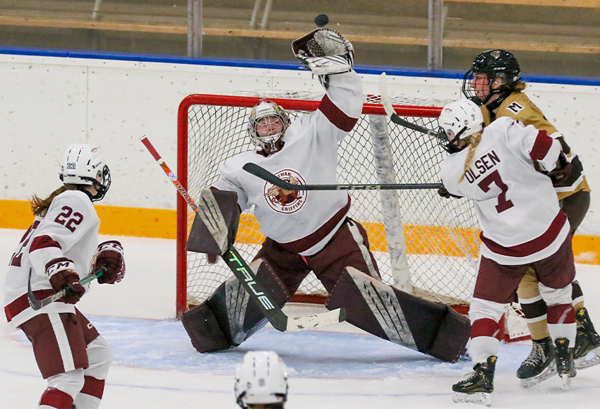 Lindsey Johnson reaches up for a puck against Manitoba on Friday night (Dave Mahussier photo).