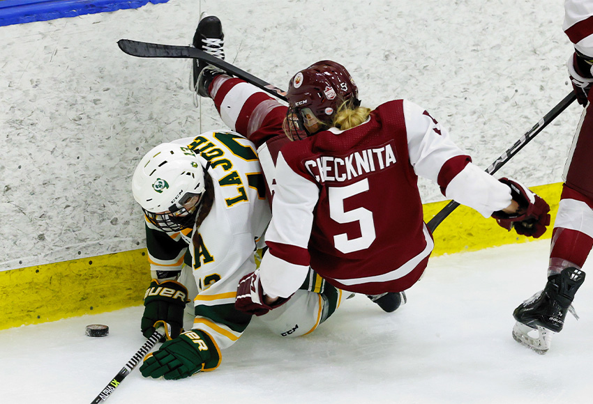 Griffins' defenceman Aspen Checknita is dumped in a corner puck scramble by Alberta's Izzy Lajoie on Friday (James Maclennan photo).