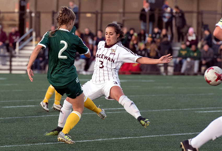 Brittany Costa, seen battling against Alberta's #2 Karissa McNutt, scored the winning goal for MacEwan in extra time on Friday night to deliver a 1-0 win over their cross-town rivals (Chris Piggott photo).