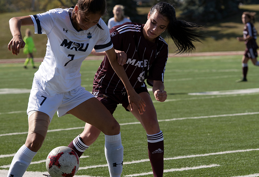 MacEwan's Meghan Oram, seen battling for the ball against MRU's Hannah Park on Sunday, scored the only goal that the Griffins would need to post a 1-0 win (Chris Piggott photo).