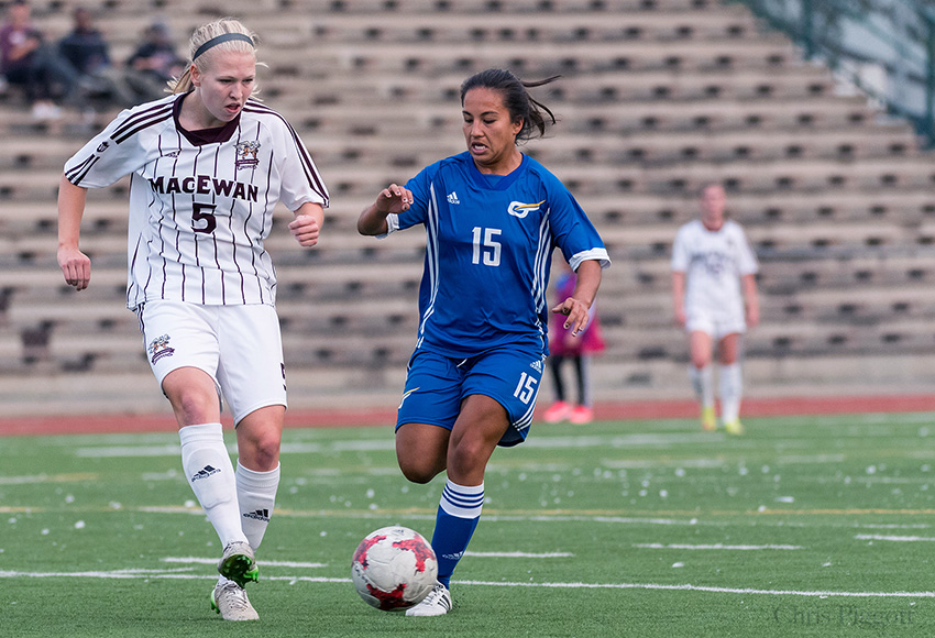 Jamie Erickson battles UBCO's Lauren Candelario in a game between the teams earlier this season. The Heat stunned the favoured Griffins 1-0 on Saturday, but it won't cost MacEwan in the standings (Chris Piggott photo).