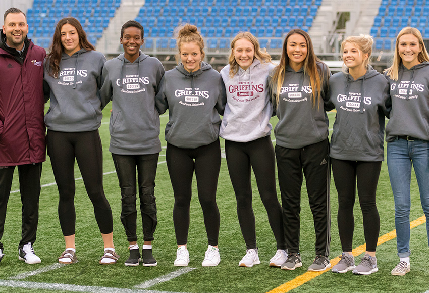 Griffins women's soccer head coach Dean Cordeiro, left, poses with 2019 recruits (left to right) Sofia DiGiacomo, Shanice Alfred, Abbey Wright, Kaitlin Willisko, Taylor Blight, Alyssa Lindford and Avery Brisebois at a recent home game.