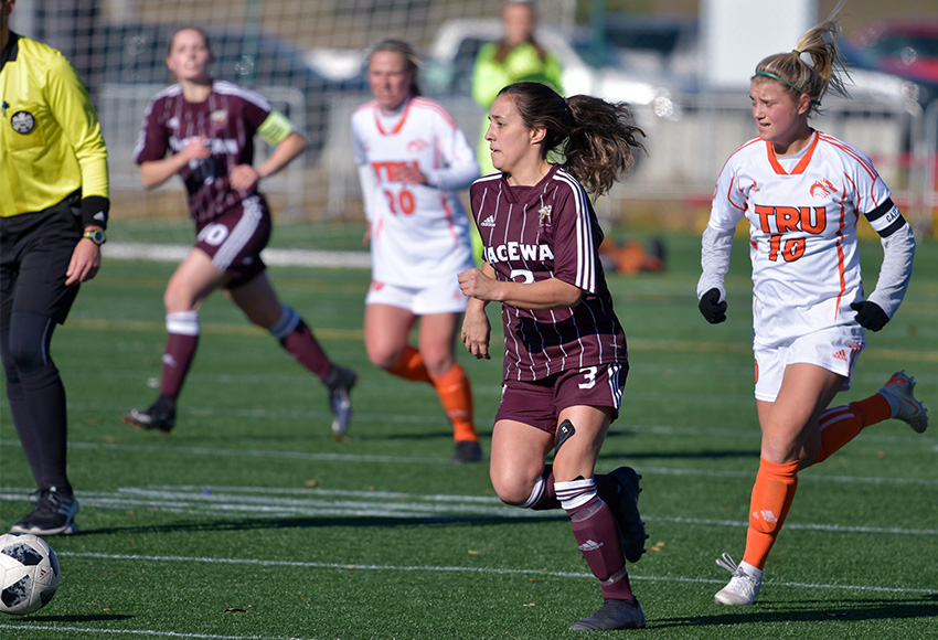 Brittany Costa chases down a loose ball in front of TRU's Marisa Mendonca on Sunday (Chris Piggott photo).