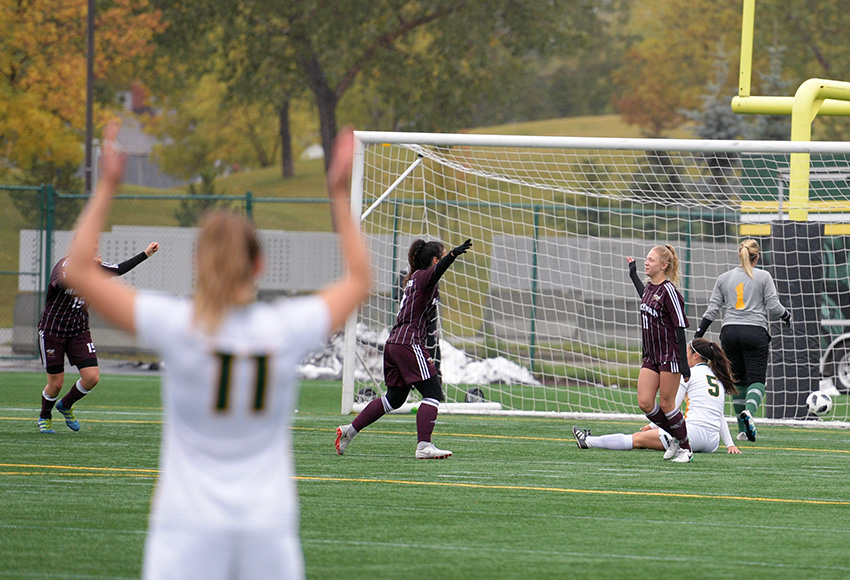 Raeghan McCarthy, right, and Suekiana Choucair celebrate an early goal against Regina on Sept. 16 at Clarke Stadium. The Griffins and Cougars will meet in the opening round of the Canada West playoffs on Friday at Foote Field (Chris Piggott photo).