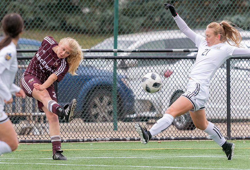 Hannah Supina boots the ball past UBC's Jessica Williams during a 2018 match. The first-year Griffins defender had a terrific campaign, making the U SPORTS all-rookie squad (Chris Piggott photo).