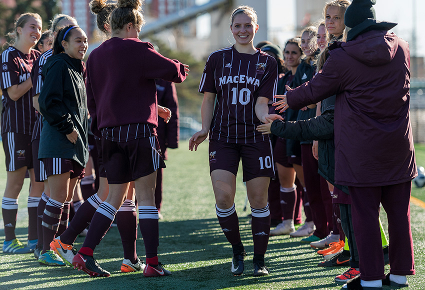 Kristyn Smart is feted by her teammates in a traditional graduating senior reception line following MacEwan's final home game of the 2018 season. She decided to return to the Griffins in 2019 after fully recovering from injuries (Chris Piggott photo).